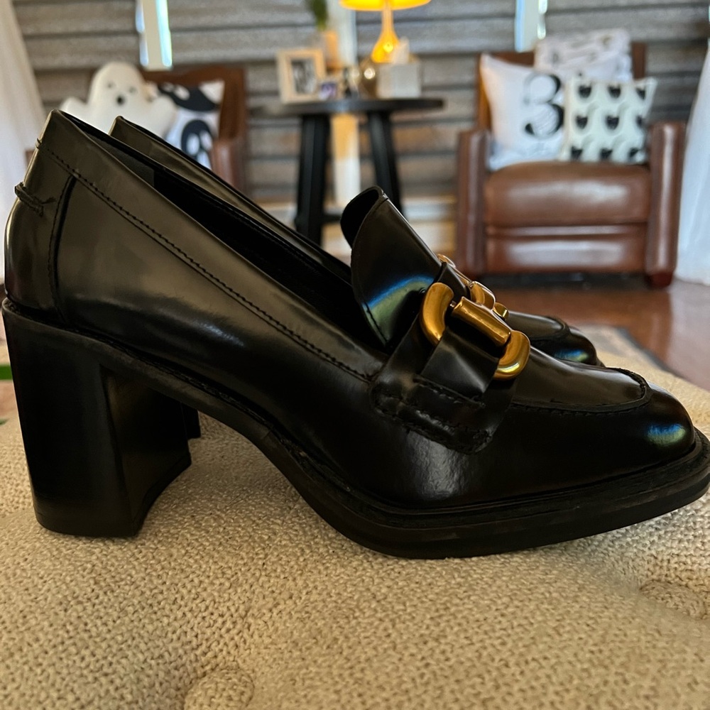 Gorgeous high gloss black leather, 4 inch stacked heals. From Boden.